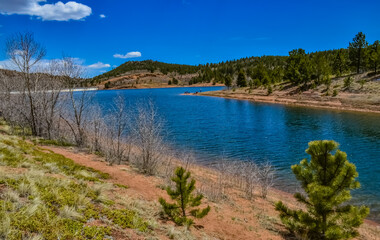Fototapeta na wymiar Crystal Creek reservoir near snow-capped mountains Pikes Peak Mountains in Colorado Spring, US