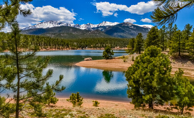 Panorama Snow-capped and forested mountains near a mountain lake, Pikes Peak Mountains in Colorado...