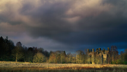 Dramatic view of storm clouds over Dunmore House, Airth, Falkirk, Scotland.