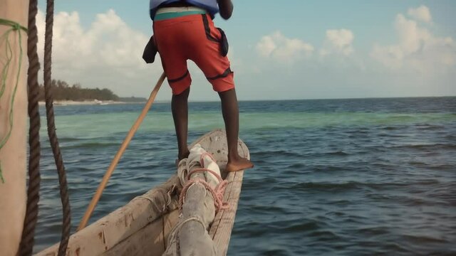 Vacation Adventure In Boat On Indian Ocean.Fisherman On Zanzibar Tanzania.Travel Water Tourism Holidays Vacation.Traditional Wooden Boat Fishermen In Indian Ocean.Tourist Exploring Tropical Beach.