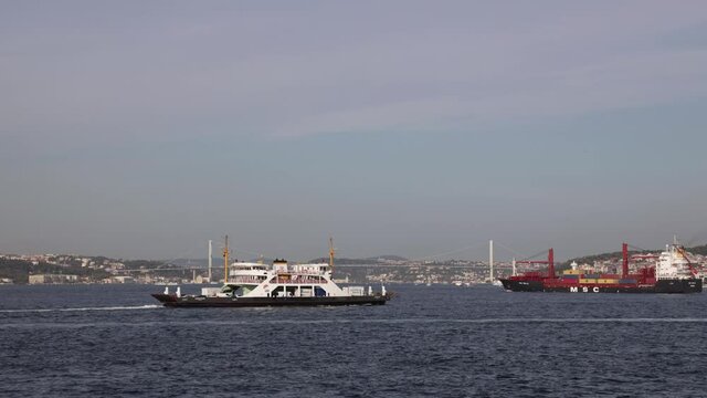 Istanbul Bosporus and 15 Temmuz Sehitler Bridge timelapse along with local ships, small boats, ferryboats, commercial ships passing on the sea Sea gulls are flying
