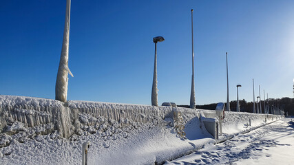 Ice sculptures on the breakwater created by nature in winter