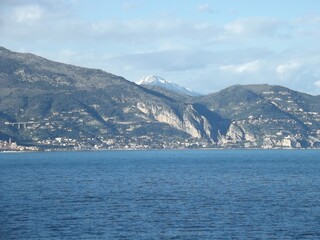 view towards the cote d’azur with the snow capped mediterranean alps in the background