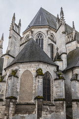 Fototapeta na wymiar Gothic building of Saint-Aignan d'Orleans (1509) - collegiate church in Bourgogne quarter of Orleans on north bank of Loire. Church is dedicated to Saint Anianus, bishop of Orleans. Orleans, France.