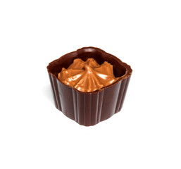 Chocolate candy with cream on a white isolated background. Idea for dessert in a restaurant