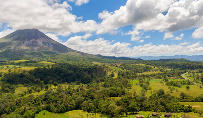 Amazing view of beautiful nature of Costa Rica with smoking volcano Arenal background. Panorama of volcano Arenal, La Fortuna, Costa Rica. Central America.