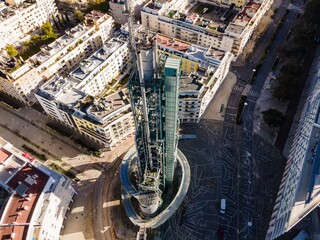 Fototapeta premium Lisbon, Portugal - 14 February 2021: Aerial view of the Galp Tower, an old oil refinery complex in disuse from Universal Exposition in Lisbon industrial district, Lisbon, Portugal.