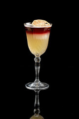Whiskey Sour cocktail isolated on a black background.
