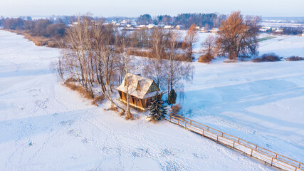 A fisherman's house on an island with a bridge in the middle of a river, an abandoned, the village...