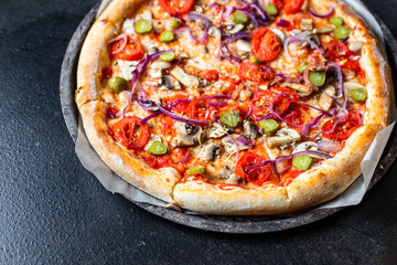 pizza vegetable tomato, pickles, mushrooms vegan or vegetarian no meat on the table healthy snack top view copy space food background rustic 