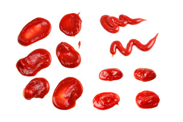 Red sauce splashes isolated on white background. Ketchup.