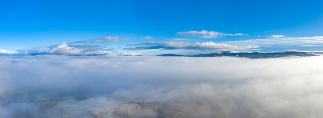 Above the clouds at Portnoo in County Donegal with fog - Ireland