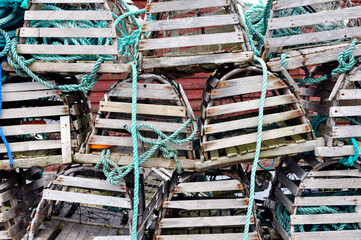 Stacks of lobster traps in a traditional fishing village in along the rugged Newfoundland coast.