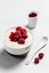 Delicious healthy breakfast creamy rice pudding in a bowl. Space for text.