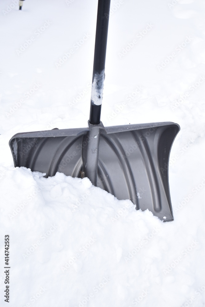 Poster snow shovel in snow