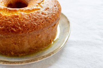 orange cake on rustic plate with space for text