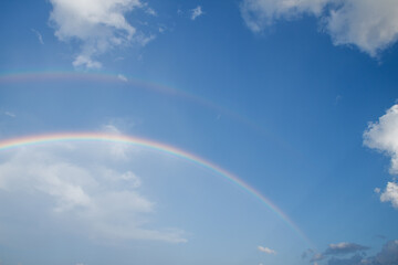 Blue sky and white cloud with rainbow