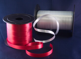 Gift strings on plastic reels.