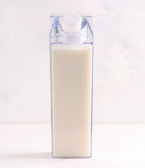 mock up bottles with milk on a light background