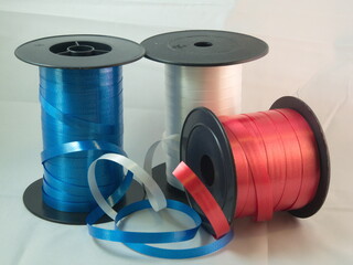 Gift strings on plastic reels.