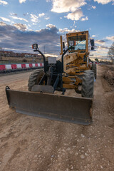 Excavator at a construction site, performing earth moving work