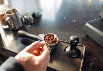 Happy smiling professional barista in cafe