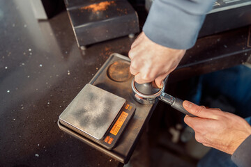 Happy smiling professional barista in cafe