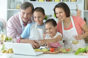 happy family cooking together in kitchen
