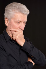 Fototapeta premium portrait of sad senior man in studio