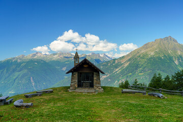 Obraz premium Mountain landscape at summer along the road from Mortirolo pass to Aprica
