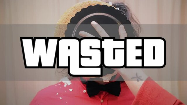 An extrovert man receiving a whipped cream pie in the face while dancing; a flashing white text appears, Wasted (a popular internet meme from video games).
