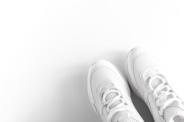 part of white sneakers on white background, top view, Active lifestyle. Summer concept.