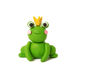 Cute plasticine frog in a crown on a white background