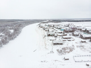 Fototapeta na wymiar December, 2020 - Kimzha. View of the northern Russian village of Kimzha. Russia, Arkhangelsk region, Mezensky district 