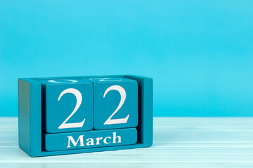 wooden calendar with the date of 
March 22 on a blue wooden background, 
International Taxi Driver Day; International Day of Idleness; World water day	