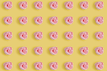 Crumpled pink table-napkin repeating pattern on yellow background. Minimal design concept