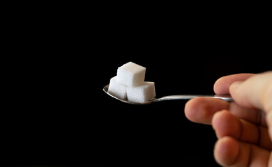 sugar cubes in a spoon