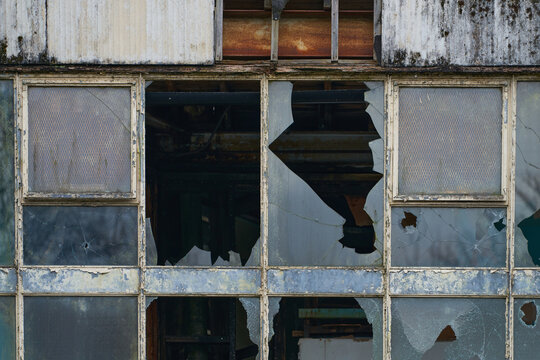 Abandoned industrial mill with broken windows