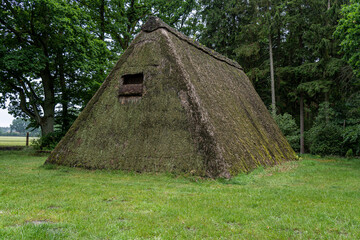 Characteristic stable for German moorland sheep with a straw roof  in the natural preserve Lueneburger Heide