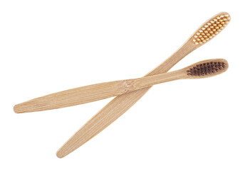 Two eco-friendly bamboo toothbrushes isolated on a white background, top view. Wooden toothbrushes.