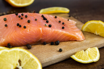 Raw salmon fish fillet with lemon