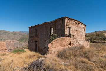 Ruined and abandoned farmhouse on a mountain in southern Spain