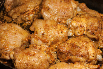 Baked pieces of chicken meat in its own juice