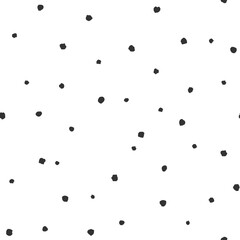 Seamless abstract pattern of little black shabby dots or spots on white.