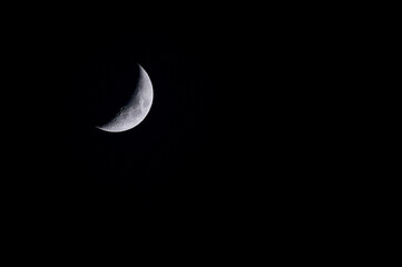 color photo of the waxing moon over Mainz, Germany with copy space for any text
