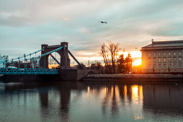 Fototapeta premium beautiful sunset overlooking the old bridge over the oder river in wroclaw in poland