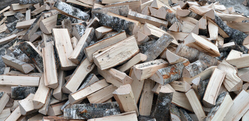 A Stack of birch firewood close up.