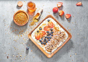 Muesli with yogurt and berries, healthy breakfast