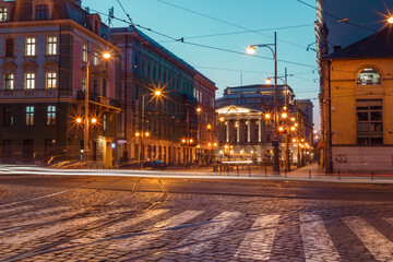 Wroclaw evening street with beautiful old buildings and transport