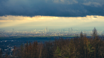 Fototapeta premium The skyline of the financial district of Frankfurt at sunset blue hour with fantastic sky and clouds